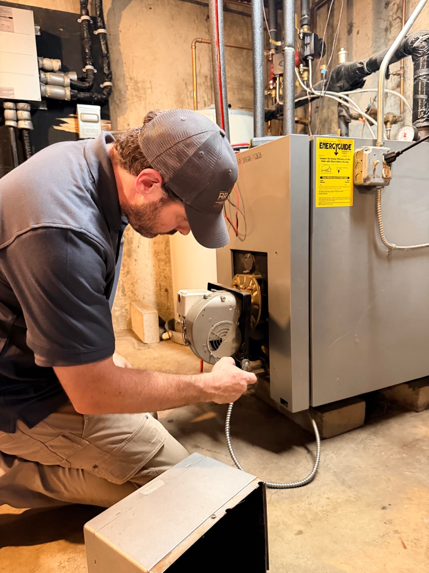 Patrick Brady servicing a residential boiler in a Massachusetts basement